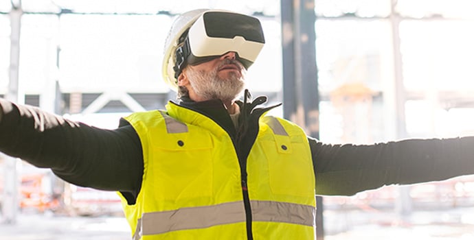 man-engineer-using-vr-goggles-on-construction-site