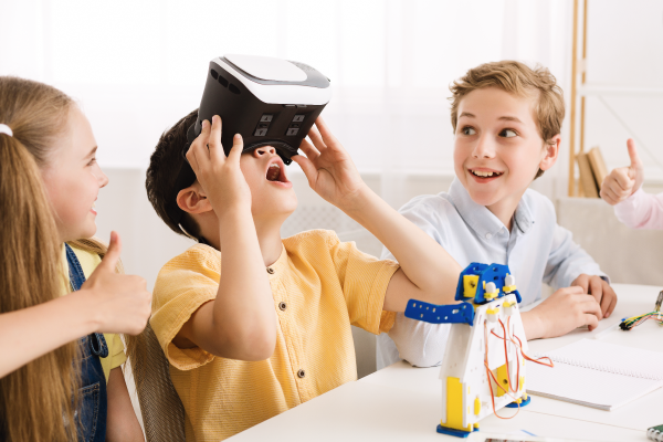 schoolboy-playing-with-vr-glasses-in-classroom