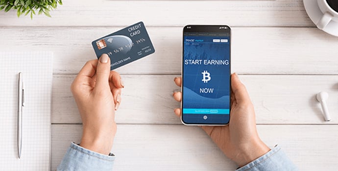 woman-using-credit-card-and-bitcoin-earning-mobile-1-1