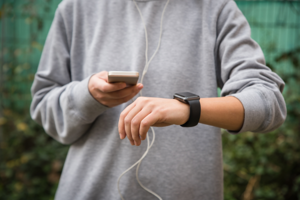 young-woman-using-wearable-tech-during-fitness